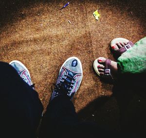 Low section of man standing on street