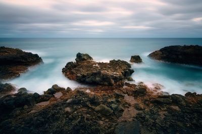 Rocky coastal volcanic landscape scenery at charco del palo, lanzerote, canary islands