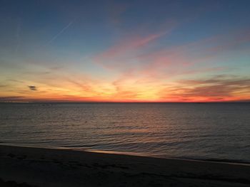 Scenic view of sea against sky at sunset