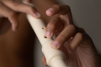 Cropped hand of woman holding mobile phone