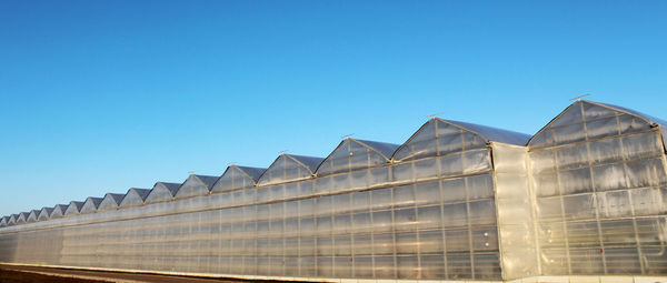 Low angle view of buildings against clear sky