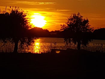 Scenic view of sunset over river