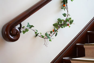 Flowers on the handrail of the stairs