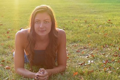 Portrait of beautiful young woman in field