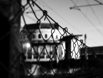 Close-up of chainlink fence against sky