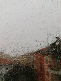 Full frame shot of wet window in rainy season