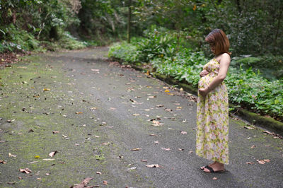 Girl lying down on tree