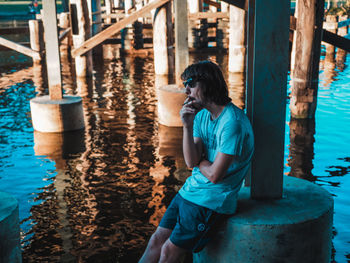 Full length of man standing by water