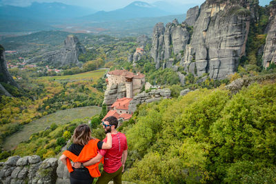 High angle view of couple standing on mountain