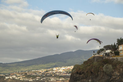 Aerial view of people and mountains against sky