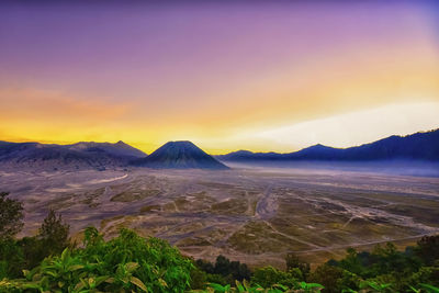 Scenic view of landscape against sky during sunset
