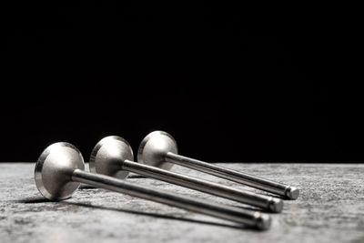 Close-up of chess pieces against black background