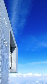 Low angle view of built structure against blue sky