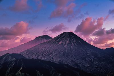 Scenic view of snowcapped mountains against sky during sunset