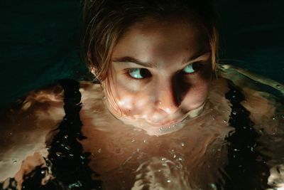 Close-up portrait of woman swimming in sea