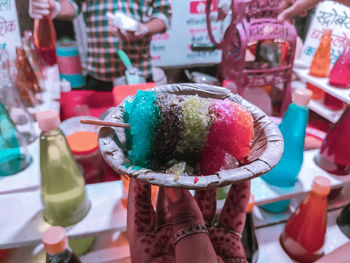 Close-up of hand holding ice cream