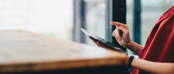 Side view of woman using mobile phone