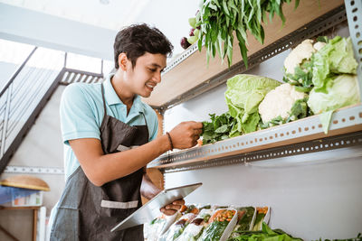 Midsection of man working at table