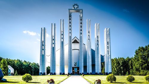 Panoramic view of buildings against blue sky