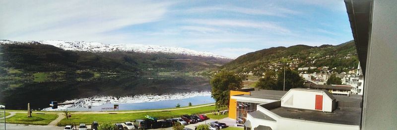 Scenic view of lake and mountains against sky