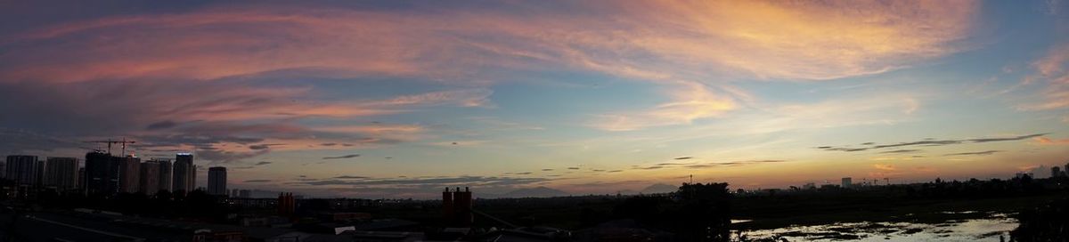 Silhouette of buildings with sky in background