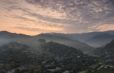 High angle shot of townscape against sky during sunset