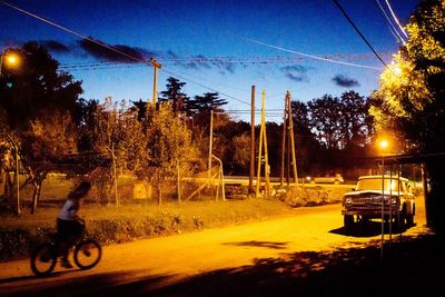 Cars parked on road at night