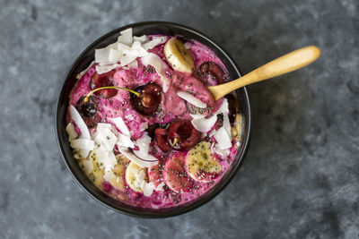 Top view of pink ice cream with fresh fruits