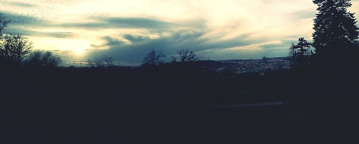 Scenic view of landscape against cloudy sky