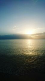 Scenic view of sea against sky at sunset