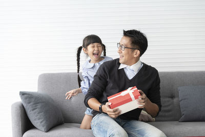 Young couple sitting on sofa
