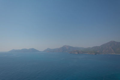 Scenic view of sea against clear blue sky