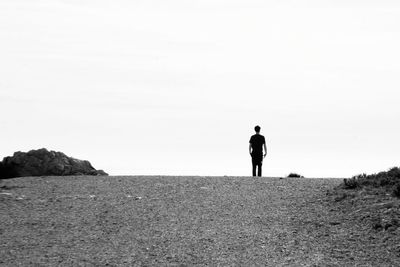 Full length of woman standing on tree