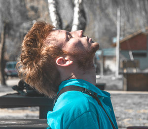 Close-up portrait of man with ice cream on street