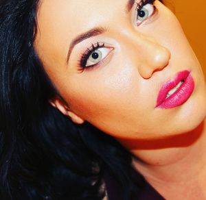 Close-up portrait of young woman with make-up