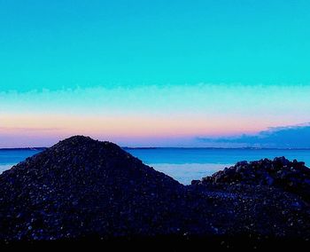 Scenic view of sea at sunset