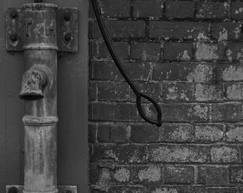 Close-up of pipes against wall