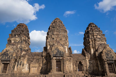 Low angle view of old temple against sky