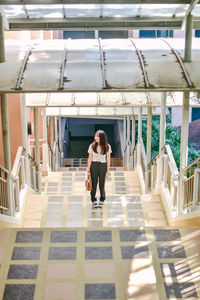 Full length of woman on staircase