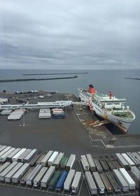 High angle view of boats moored on sea against sky