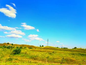Scenic view of landscape against blue sky