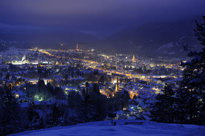 View over city garmisch-partenkirchen in cold winter night