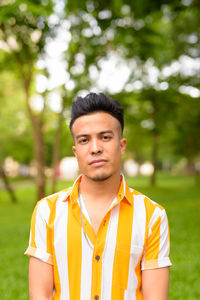 Portrait of young man standing outdoors