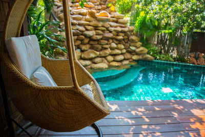 Wicker chair at poolside