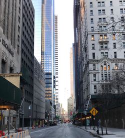 Road amidst buildings in city