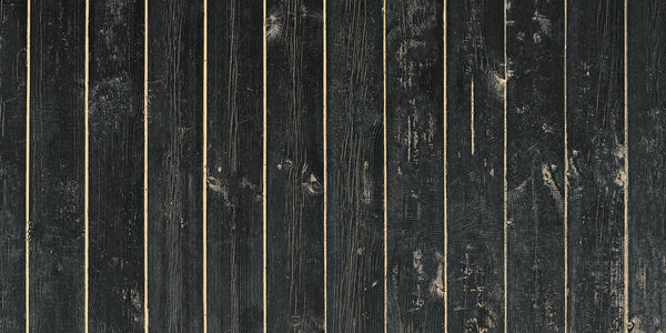 Black wooden fence, close-up, vintage background