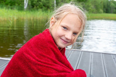 Portrait of smiling mid adult woman in lake