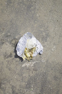 High angle view of garbage on sand