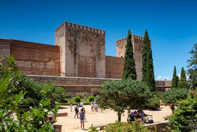 Group of people in front of historical building