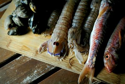 High angle view of fresh seafood on cutting board in kitchen at home